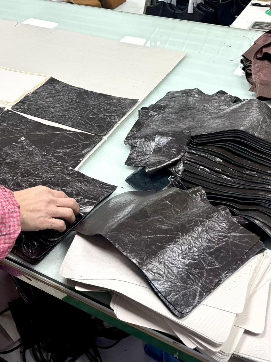 Cut material panels prepared for bag production